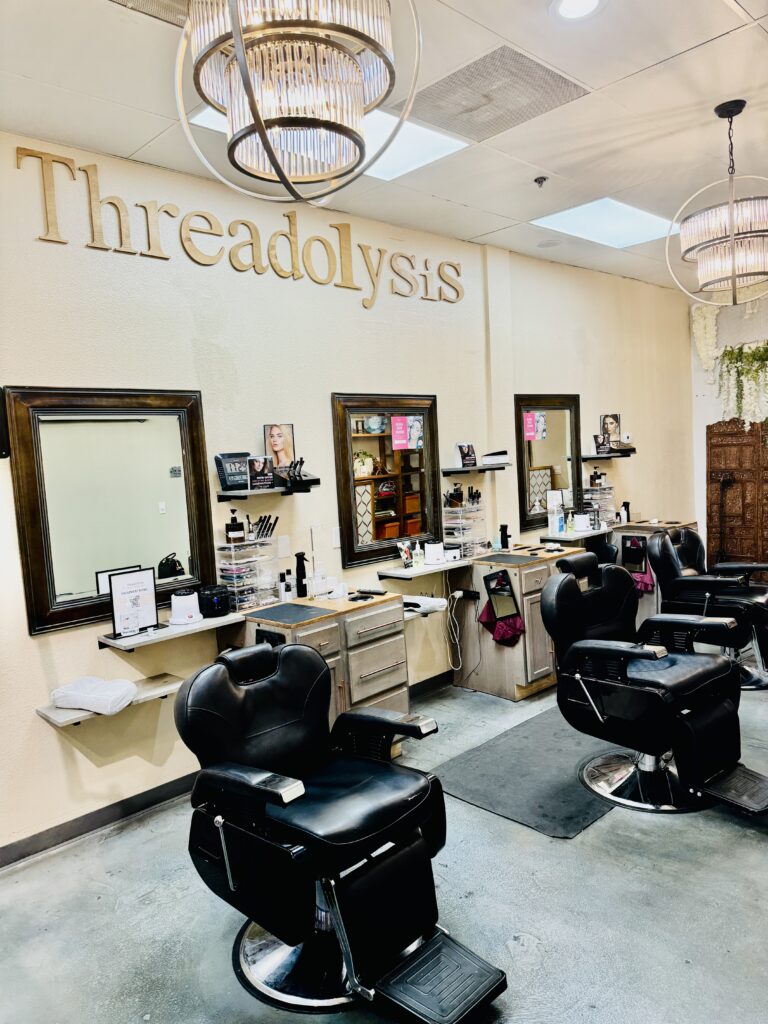 Threadolysis beauty stations with salon chairs and mirrors